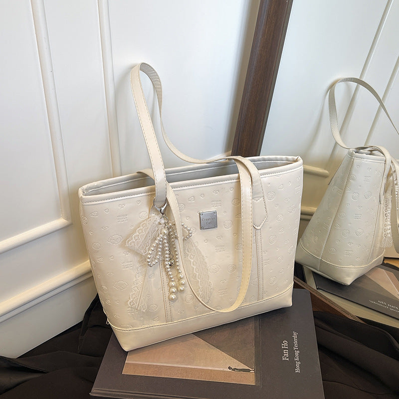 European and American Trendy Simple Large Capacity Tote Bag2025New high-value casual cute embossed single-shoulder handbag