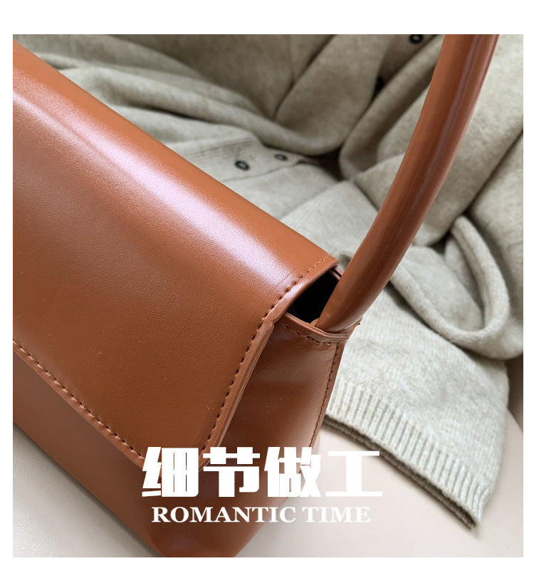 Textured French Style Women's New Fashion Retro2025Large Capacity Casual Solid Color Lock Buckle Handheld Baguette Underarm Bag for Women