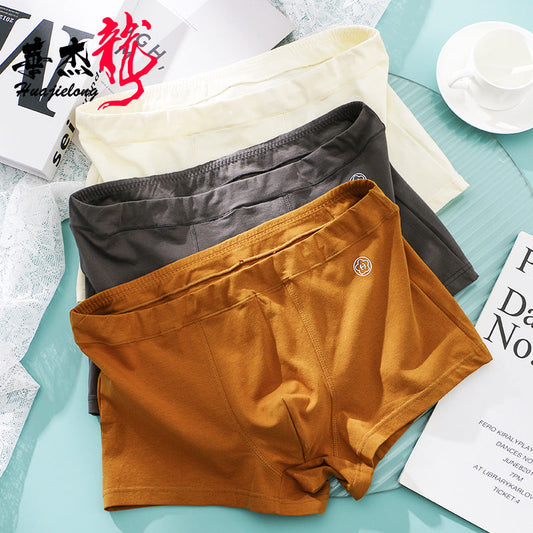 Huajie Long Solid Color Cotton Underwear Men's Underwear Slim Fit Boxer Briefs Simple Breathable Men's Comfortable Boxer Briefs Wholesale http://detail.1688.com/offer/783105309256.html