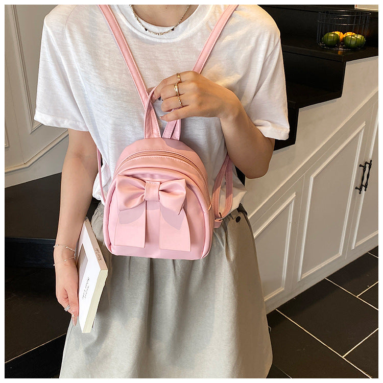 2025Summer New Niche Bow Backpack for Women, Stylish and Simple Handheld, Single Shoulder, Crossbody, and Double Shoulder Backpack