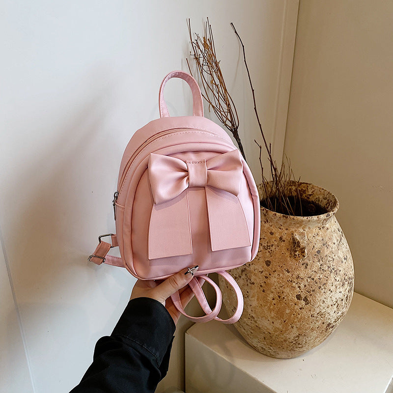 2025Summer New Niche Bow Backpack for Women, Stylish and Simple Handheld, Single Shoulder, Crossbody, and Double Shoulder Backpack