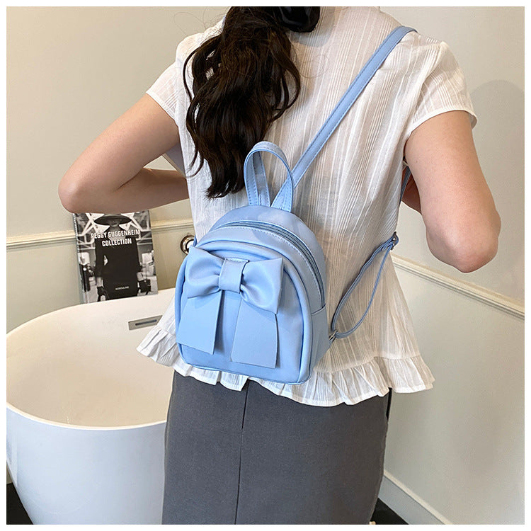 2025Summer New Niche Bow Backpack for Women, Stylish and Simple Handheld, Single Shoulder, Crossbody, and Double Shoulder Backpack