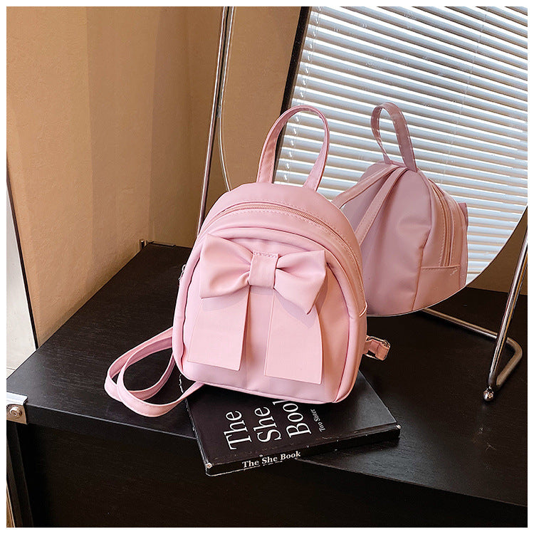 2025Summer New Niche Bow Backpack for Women, Stylish and Simple Handheld, Single Shoulder, Crossbody, and Double Shoulder Backpack