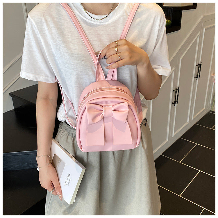 2025Summer New Niche Bow Backpack for Women, Stylish and Simple Handheld, Single Shoulder, Crossbody, and Double Shoulder Backpack